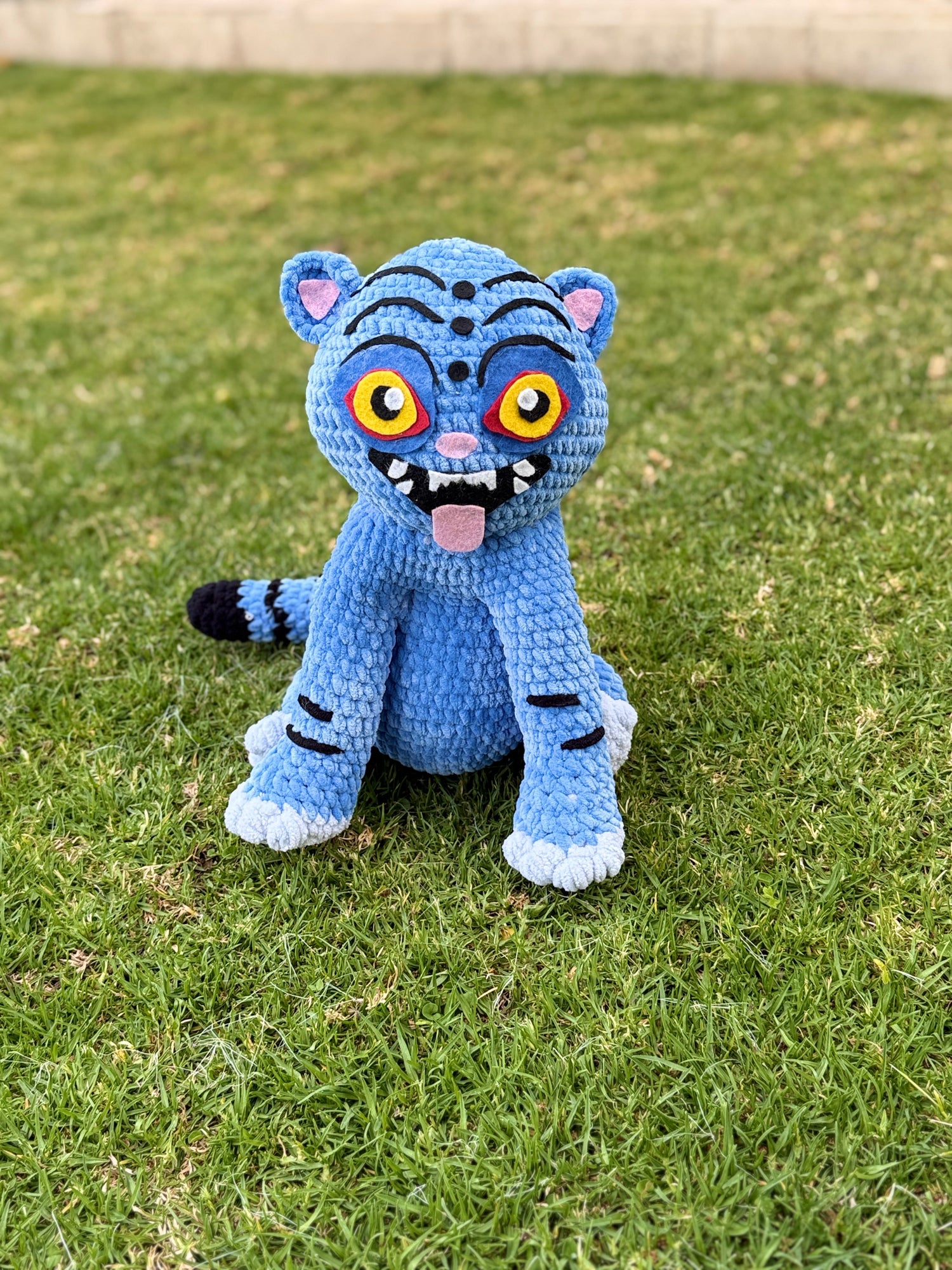 Handmade crochet collectible plush inspired by Demon Hunters character, detailed with yarn armor and expressive design by Hanneaise Handmade.