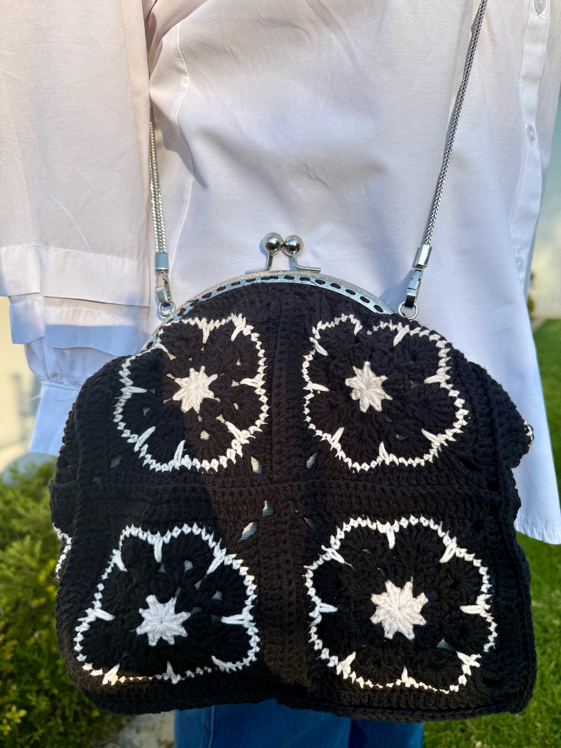 Handmade black and white crochet shoulder bag with silver metal kiss lock frame