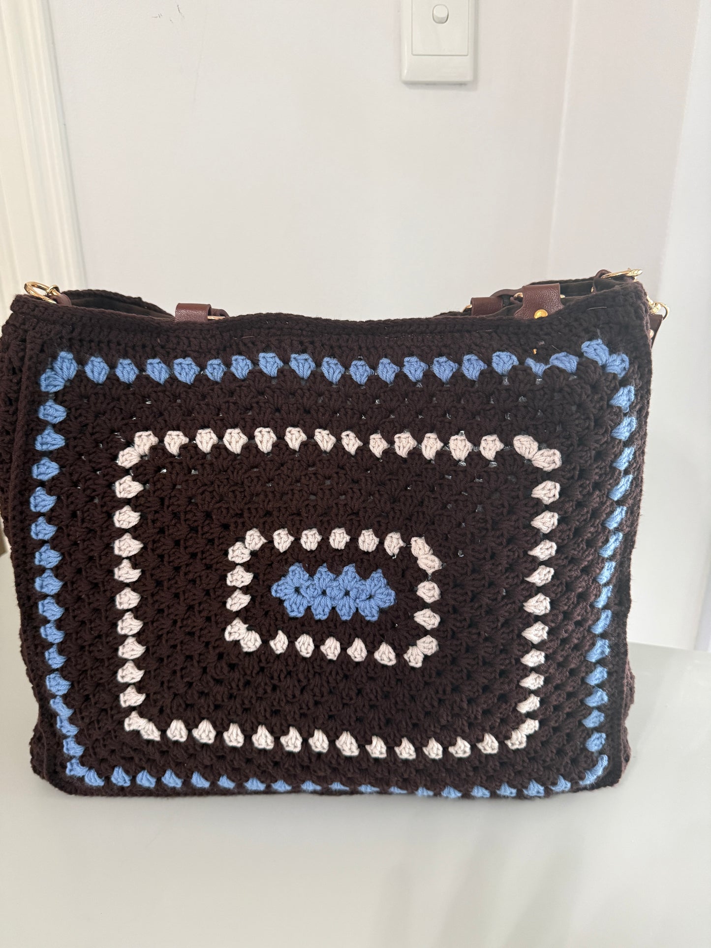 Carryall Large brown crochet bag with blue border and cream spiral detail