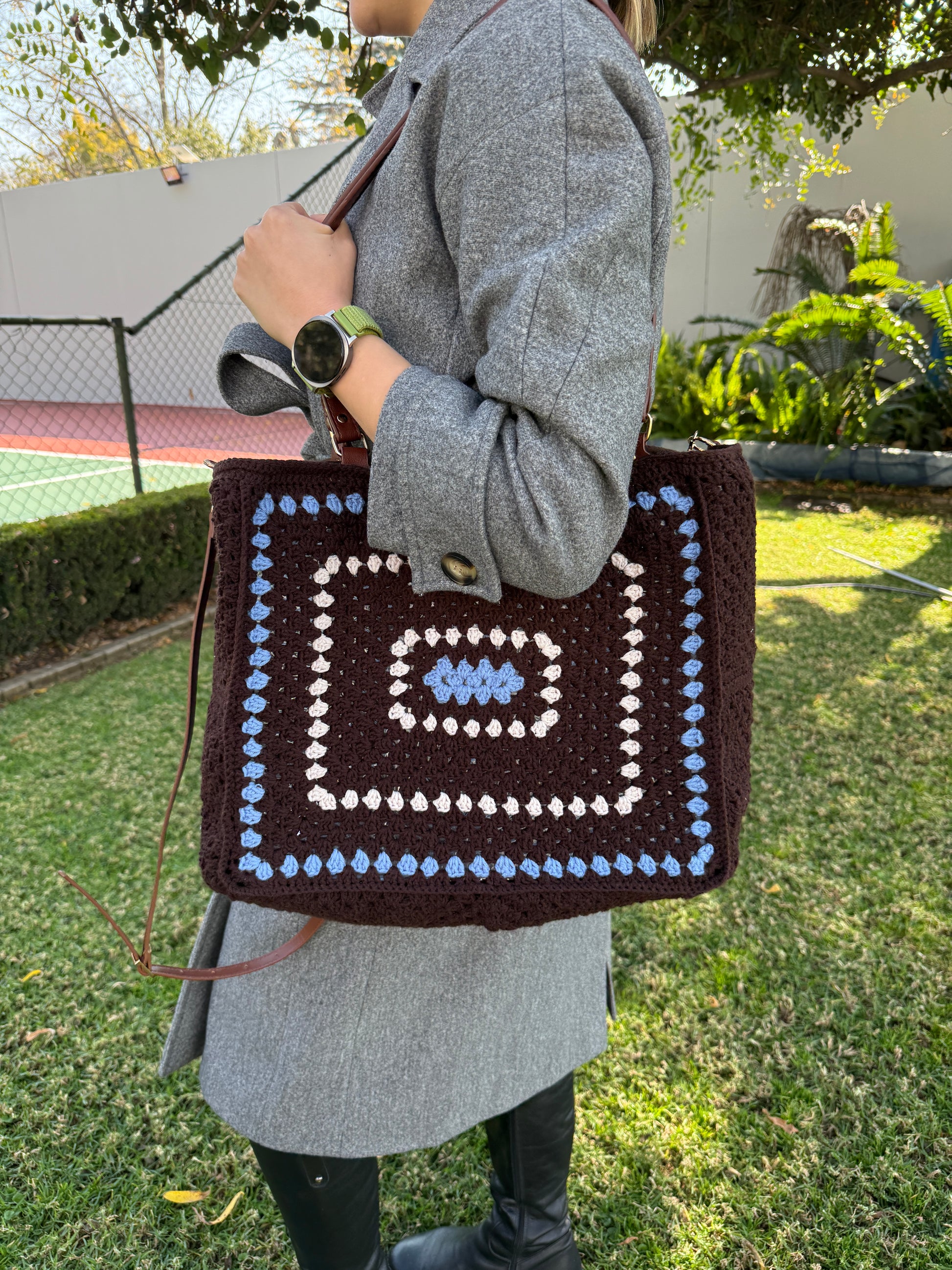 Handmade crochet tote bag styled with book for cozy everyday use