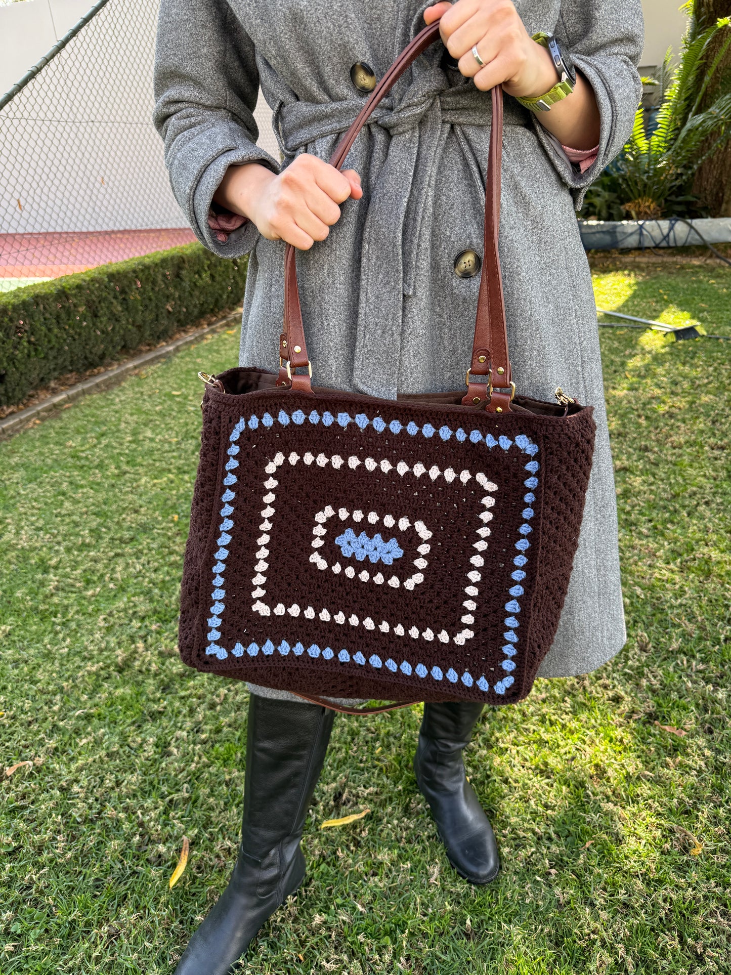 Large crochet shoulder bag styled with grey coat for everyday use