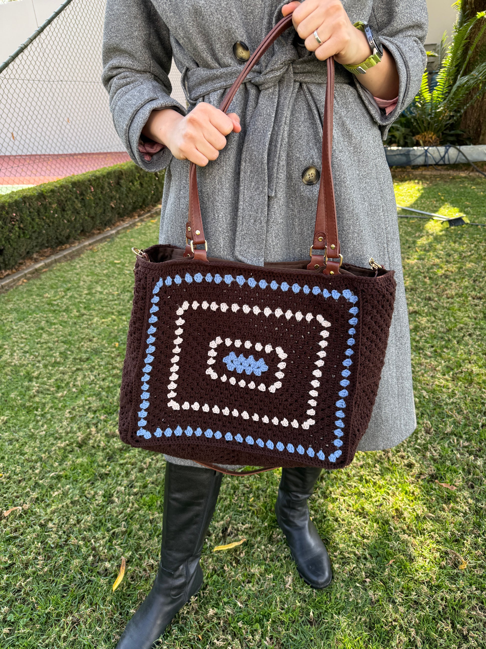 Large crochet shoulder bag styled with grey coat for everyday use