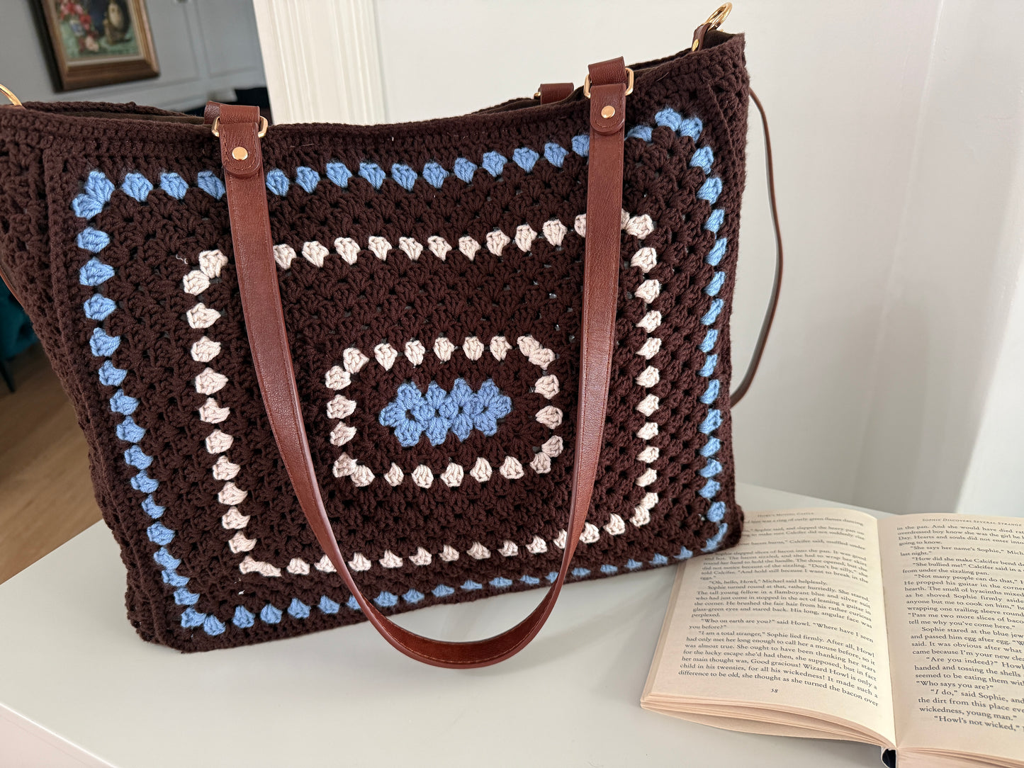 Handmade crochet tote bag styled with book for cozy everyday use