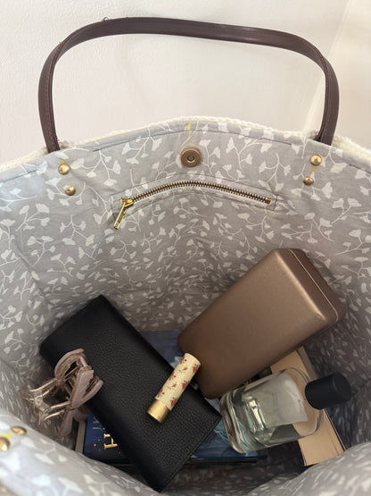 Large handmade crochet tote bag with grey floral lining, zip pocket and everyday essentials inside