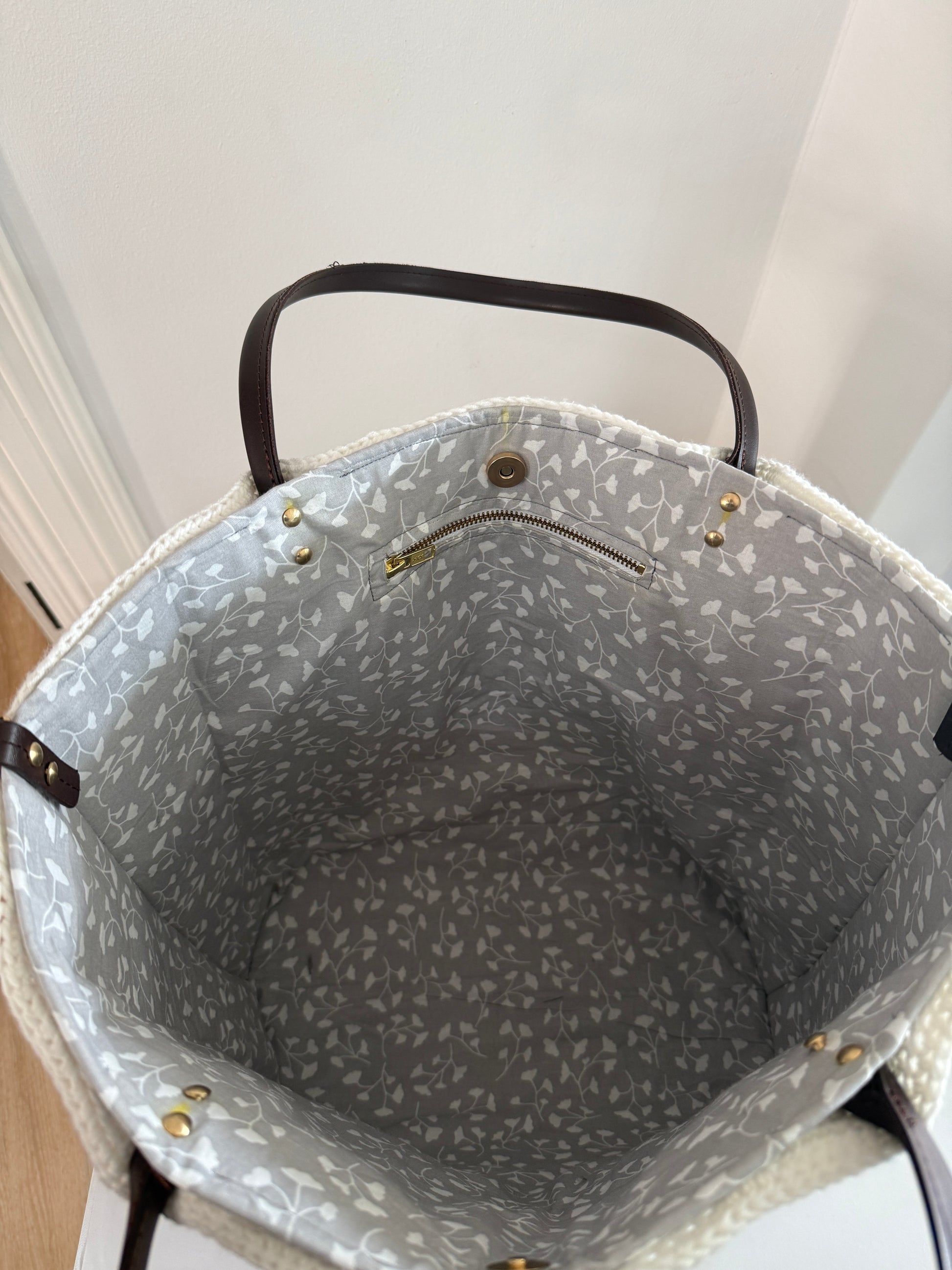 Fully lined large crochet tote bag with grey floral cotton lining and inner zip pocket