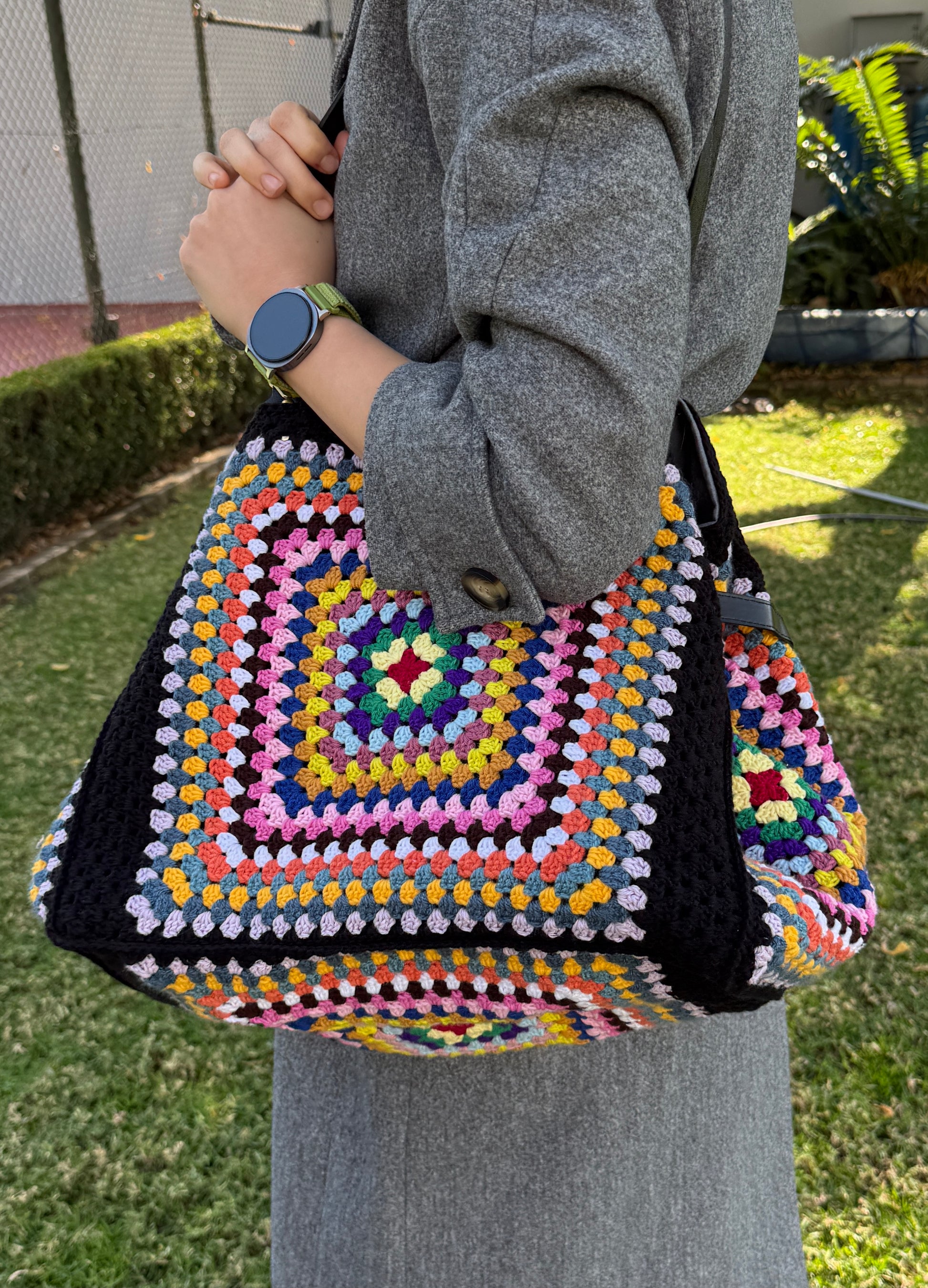 Oversized crochet tote bag with colorful granny squares and soft structure
