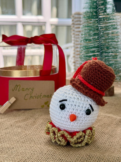 Crochet snowman ornament with carrot nose and top hat – handmade Christmas cotton bauble decoration.