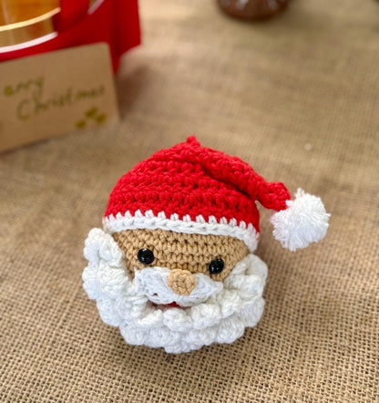 Handmade crochet Santa Claus ornament with red hat and fluffy beard – cotton yarn Christmas bauble.