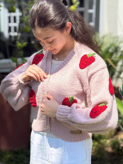 Chunky knit texture and balloon sleeves, handcrafted from acrylic yarn blend