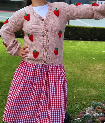 Cozy oversized strawberry cardigan styled with jeans for a casual boho look.